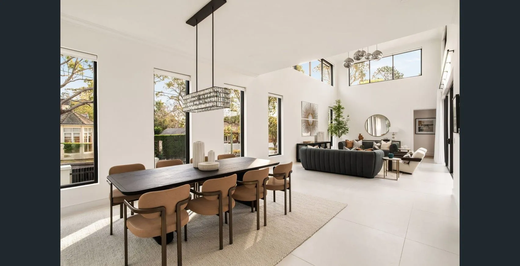 Completed bright open-plan room with dining and living areas