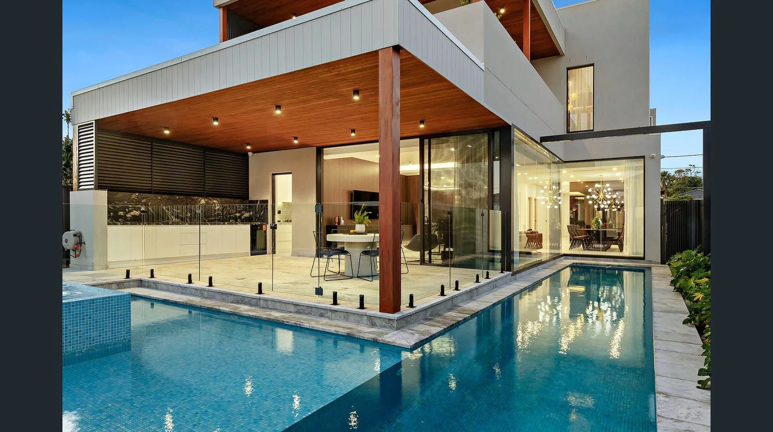 Concrete swimming pool beside a contemporary home at Sans Souci